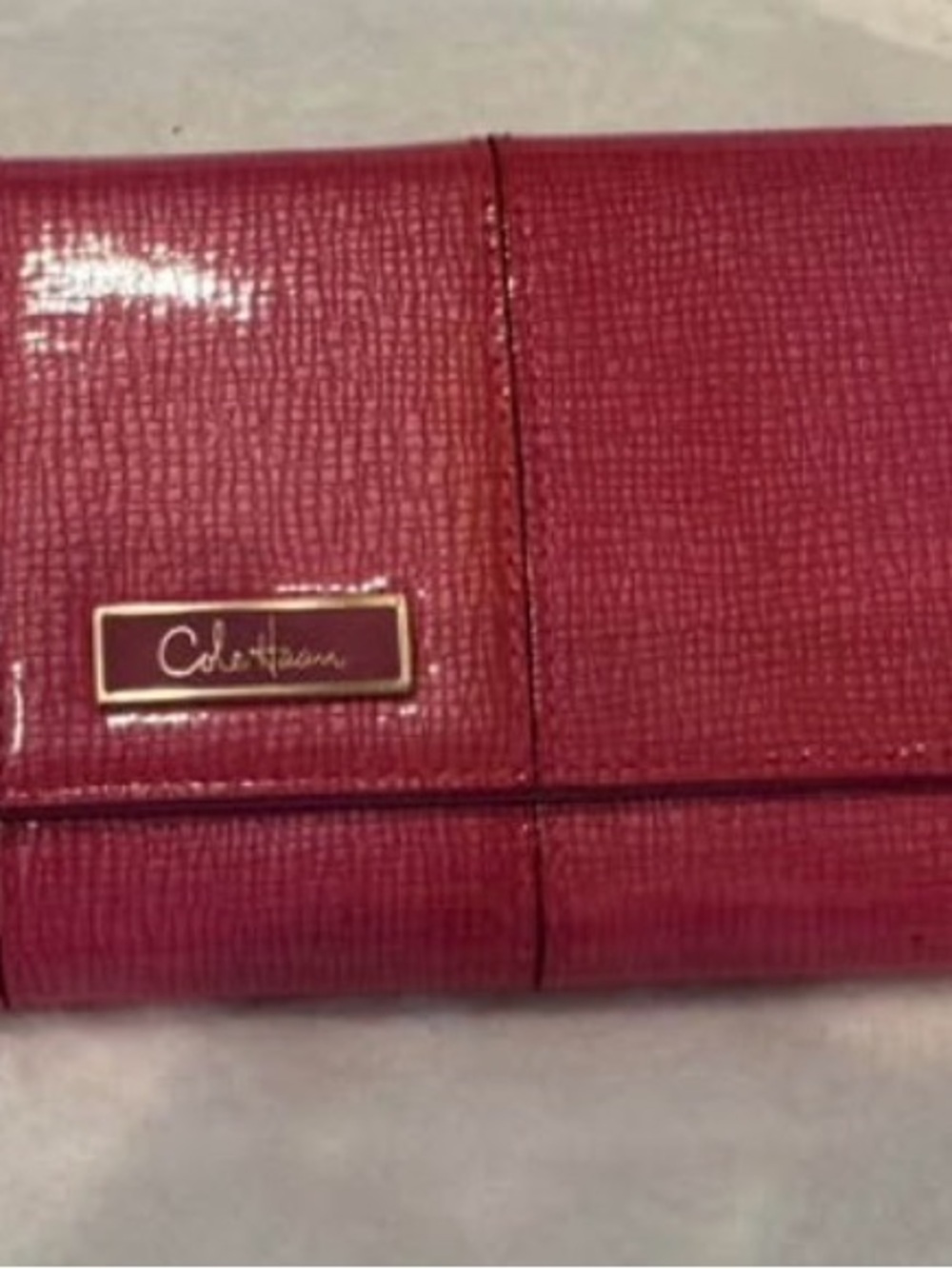 Cole Haan Pink-Red Textured Leather travel jewelry organizer with Gold Logo